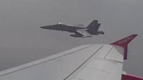 Fighter jet escorting EasyJet flight