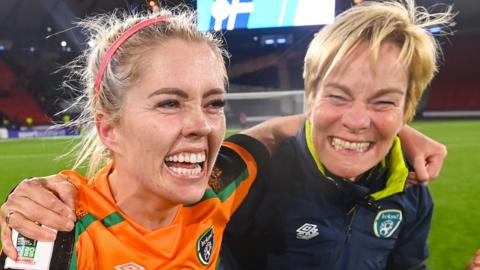 Republic midfielder Denise O'Sullivan and manager Vera Pauw celebrate qualifying for the Women's World Cup