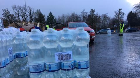 Bottled water collection point at Williamwood High School ran out of water at one point on Monday morning