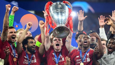 Andy Robertson lifts the European Cup with Liverpool