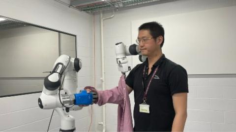 Dr Zhu with dressing robot