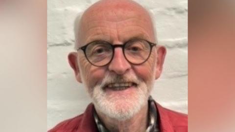 A headshot of David Gair