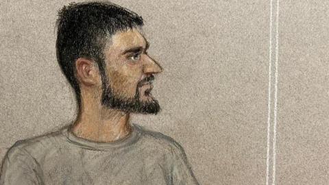 Artist's sketch of Marcus Monzo in court, wearing a grey top, beard and moustache.