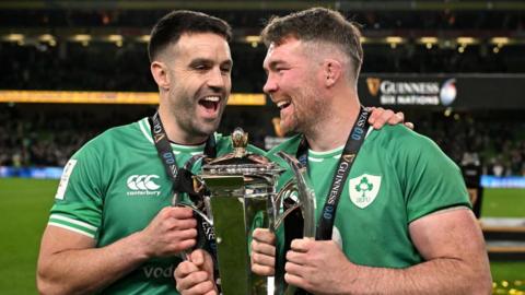 Conor Murray and Peter O'Mahony celebrate with the Six Nations trophy.
