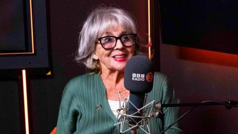 Sue Johnston and a Radio 2 microphone