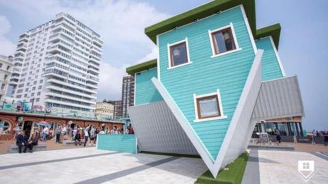 Image of what the 'upside down' house installation could look like on Blackpool's South Pier.