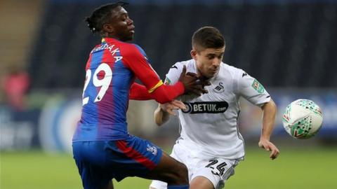 Aaron Wan-Bissaka a Declan John