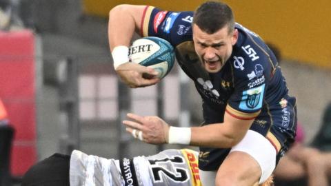 Scott Williams takes a tackle as he attacks for Scarlets