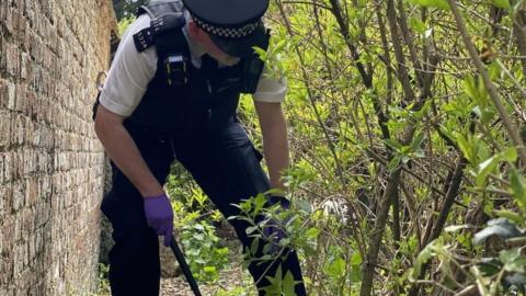 Officer searching for weapons