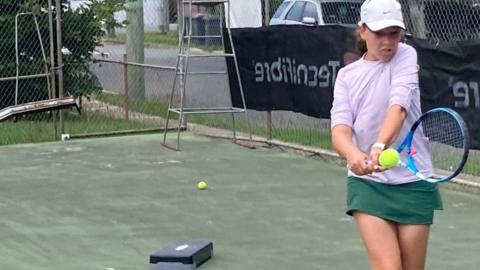 Teenage tennis player Liv Wood practising in Brisbane