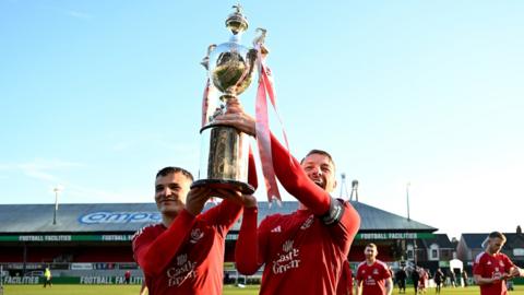 Connah's Quay Nomads' Jordan Davies and John Disney show off the Welsh Cup