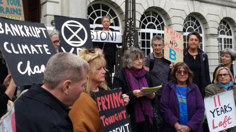 Protesters gathered outside Leeds Civic Hall ahead of the meeting