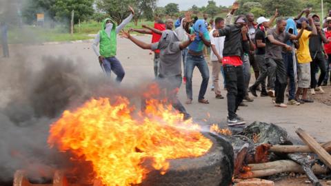 File photo: Protesters behind a burning barricade, 15 January 2019