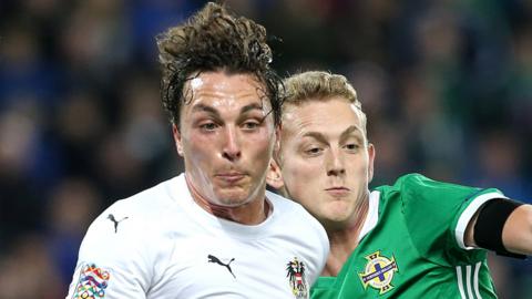 Northern Ireland's George Saville can look forward to further battles with Austria next autumn