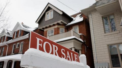 A FOR SALE sign is displayed outside a property on Brunswick Ave. in Toronto. Lance McMillan/Toronto Star March-13-2023