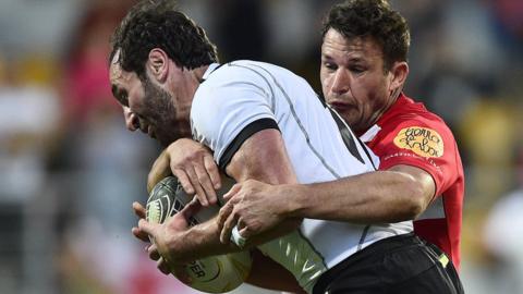 Aleksandre Todua (L) of Black Lion competes with Martin Du Toit of Castilla Y Leon Iberians during a Rugby Europe Super Cup game in April, 2022