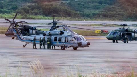 The Colombian president's helicopter sits on the runway after it is hit by gunfire, June 2021