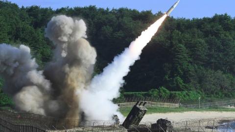 This handout photo taken on 5 July 2017 and provided by South Korean Defence Ministry in Seoul shows US M270 Multiple Launch Rocket System firing an MGM-140 Army Tactical Missile from an undisclosed location on South Korea's east coast during a South Korea-US joint missile drill aimed to counter North Koreas ICBM test.