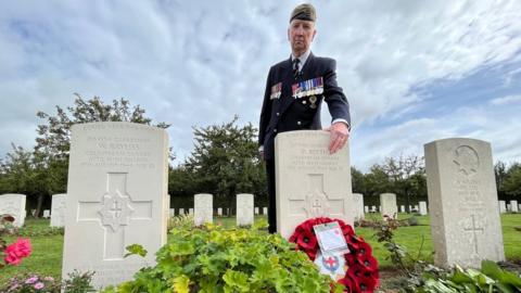 Peter Blyth at the grave of his father Guardsman David Blyth