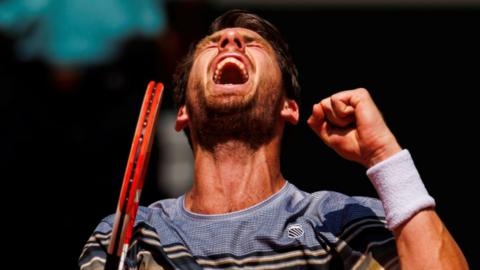 Cameron Norrie celebrates against Benoit Paire in the French Open