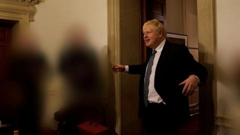 Boris Johnson with drink in hand at one of the events under investigation