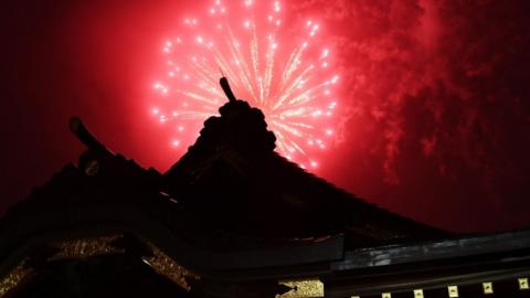 Fireworks explode over the Okunitama shinto shrine in Fuchu in the western suburbs of Tokyo