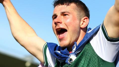 Adam Randell celebrates Plymouth Argyle's promotion to the Championship