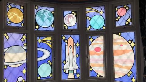 Space-themed window art