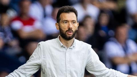 West Brom boss Carlos Corberan gesticulating on the touchline