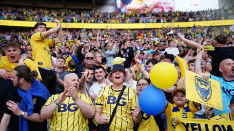 Oxford United fans celebrate in the stand at Wembley