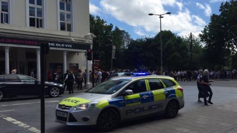 People evacuating the Old Vic Theatre