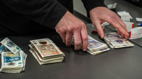 Cash seized by police in fraud crackdown