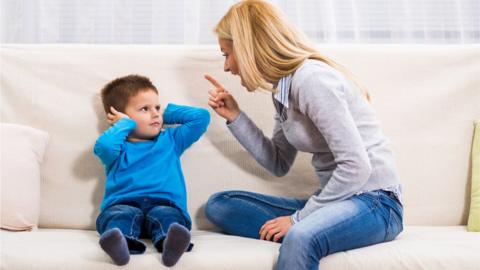 Parent telling of a child, pointing her finger