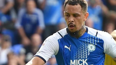 Jonson Clarke-Harris puts Peterborough ahead against Birmingham City