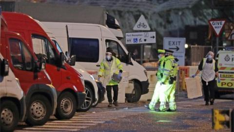 Testers prepare to take samples from drivers parked in the Port of Dover in Kent