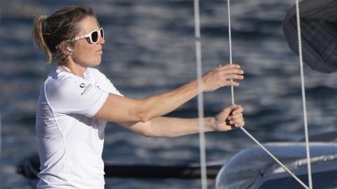 Sam Davies on her boat arriving into Cape Town