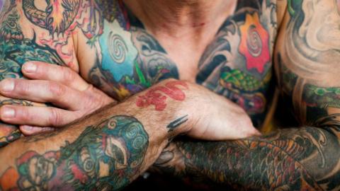 Man with tattoos