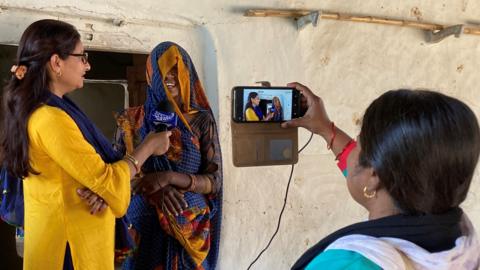 Nazni Rizvi (left) and Meera Devi (right) doing an interview