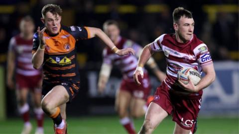 Harry Smith of Wigan Warriors makes a break during the Betfred Super League