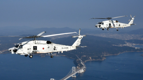 Two Japanese navy SH-60k helicopters flying over Japanese waters