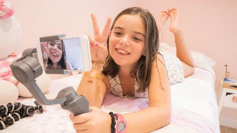 A young girl taking a selfie