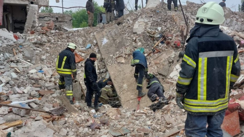 Rescuers search for survivors in the rubble of an apartment block in Chasiv Yar, eastern Ukraine. Photo: 11 July 2022