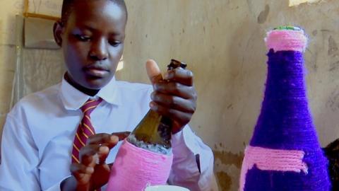 Student making bottle covers