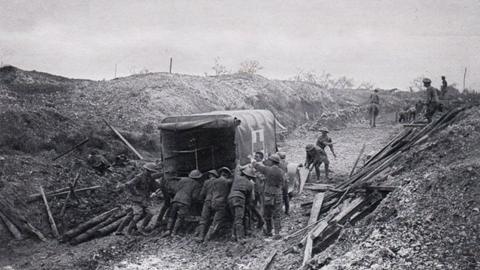 Men push ambulance through mud at Mametz Wood, July 1916