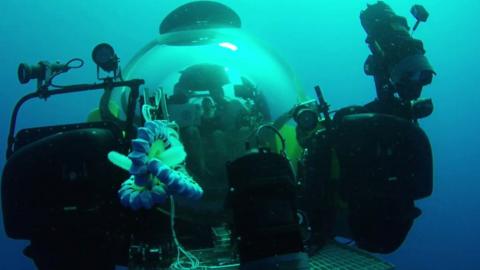 An underwater submarine fitted with a soft body robotic arm