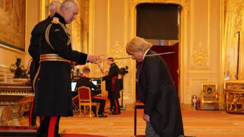 The King knighting Sir Michael Fabricant