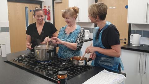 Volunteers working in the kitchen