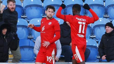 Callum Lang celebrates with Gavin Massey