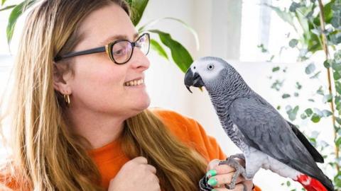 Lesley Herbert with her parrot