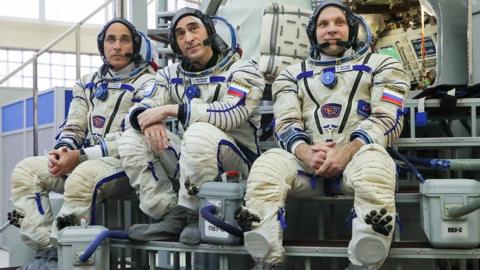 Two Russian cosmonauts and a US astronaut docked at the space station after their rocket took off from Kazakhstan.